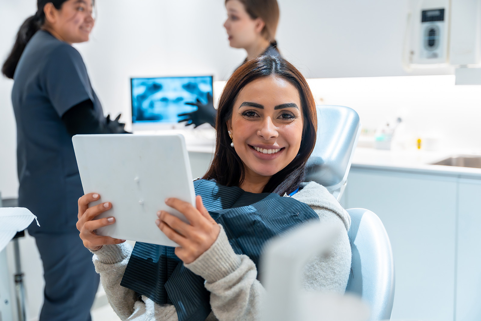 Dental clinician discussing images with a patient