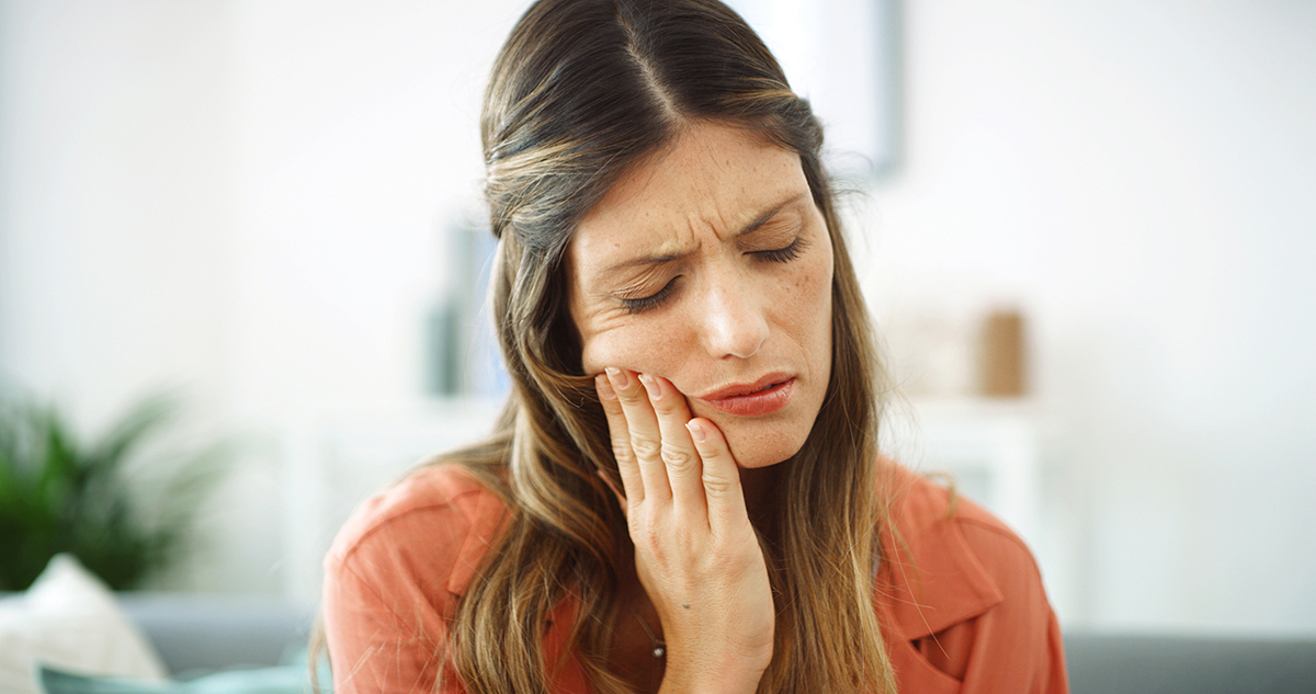 Person experiencing a toothache
